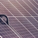 Detail of a sturdy metal mounting bracket securing solar panels, illustrating durable installation for long-lasting solar setups.