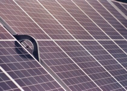Detail of a sturdy metal mounting bracket securing solar panels, illustrating durable installation for long-lasting solar setups.
