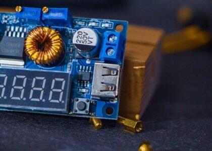 detailed view of a 12V solar charge controller circuit board with digital display, USB port, and electronic components, illustrating the article's focus on circ