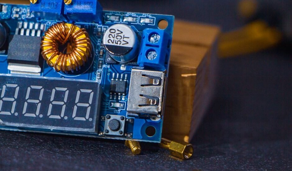 detailed view of a 12V solar charge controller circuit board with digital display, USB port, and electronic components, illustrating the article's focus on circ