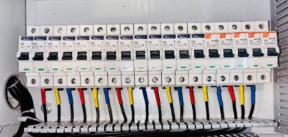 Battery isolator kit wiring and circuit breakers in an electrical panel, illustrating setup options for off-grid power systems