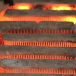 Glowing electric heating coil element, illustrating how lithium battery heaters work to maintain safe battery temperatures.
