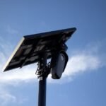 Motorized solar panel tilt mount shown from below, illustrating adjustable tracking hardware for optimizing solar energy collection.