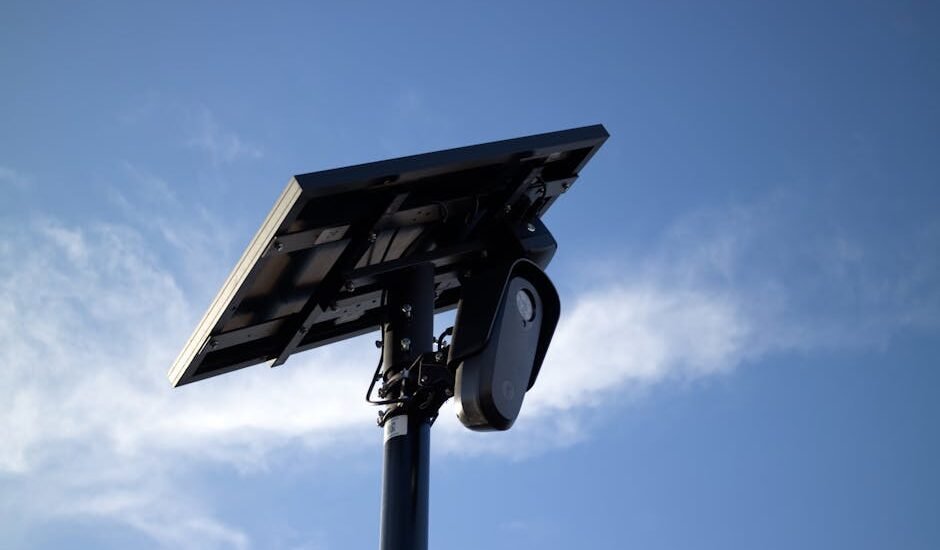 Motorized solar panel tilt mount shown from below, illustrating adjustable tracking hardware for optimizing solar energy collection.