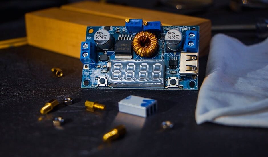Close-up of a DC to DC charger circuit board with digital display and components, illustrating RV charger selection.