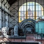 Industrial generator equipment inside a historic building, illustrating generator technology for an article on portable vs inverter generators.