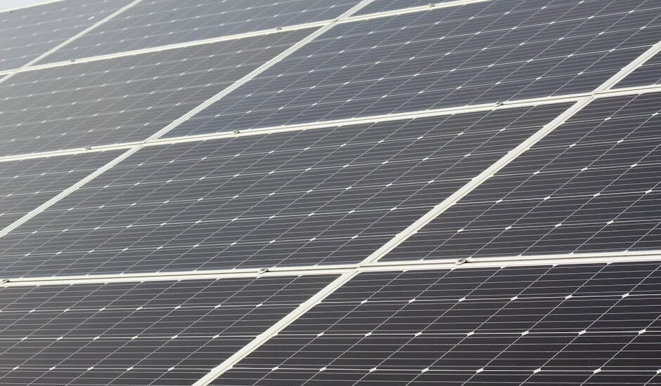 Rows of solar panels installed at a tilt, illustrating how panel angle affects sunlight capture for off-grid power setups.