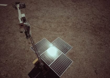 A ground-mounted solar panel array in a dry, open area, illustrating solar generator options for off-grid power needs.