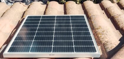 A solar panel installed on a rooftop, relevant to string vs hybrid inverter discussion.