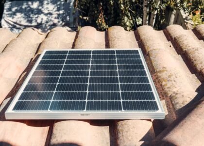 A solar panel installed on a rooftop, relevant to string vs hybrid inverter discussion.