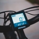 Close-up of a Himiway digital battery monitor on handlebars, illustrating battery monitoring for off-grid power setups