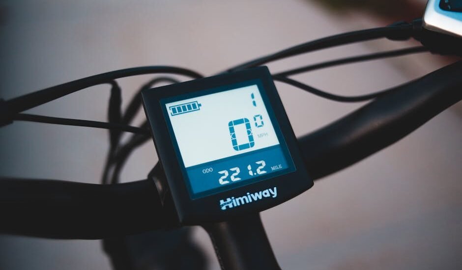 Close-up of a Himiway digital battery monitor on handlebars, illustrating battery monitoring for off-grid power setups