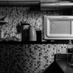 A 12V microwave oven on a kitchen counter, relevant to off-grid cooking.