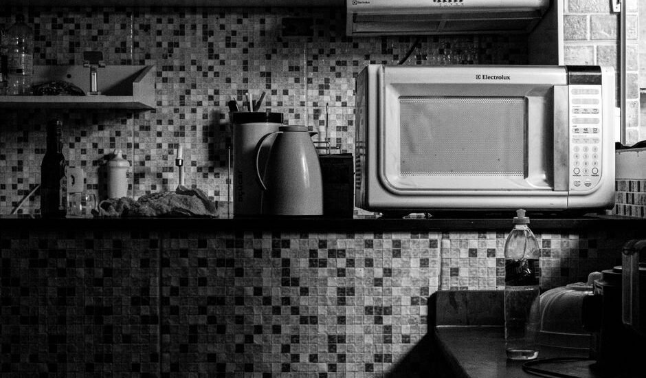 A 12V microwave oven on a kitchen counter, relevant to off-grid cooking.