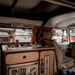 Interior of a camper van showing a portable heater and cooking area, relevant to 12V portable heaters.