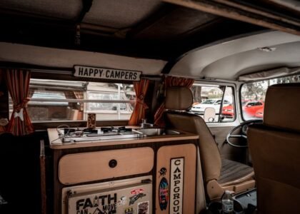 Interior of a camper van showing a portable heater and cooking area, relevant to 12V portable heaters.