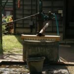 A traditional water pump setup, illustrating a practical example of water pumps for off-grid living.