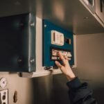 A person using a battery disconnect switch, relevant to battery disconnect switches topic.