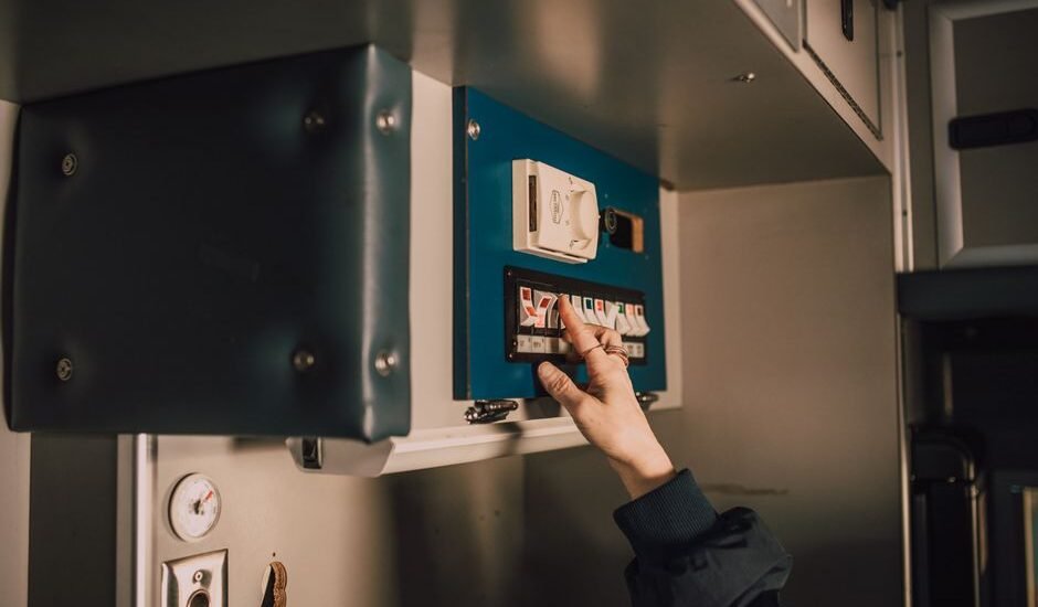 A person using a battery disconnect switch, relevant to battery disconnect switches topic.