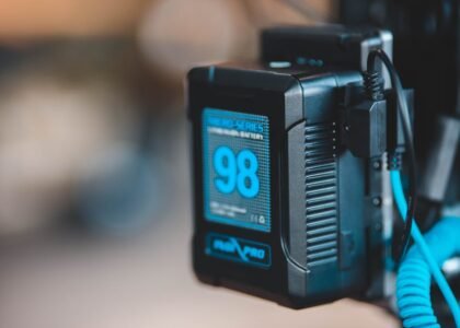 A close-up of a portable battery box with a charge indicator, relevant to off-grid power solutions.