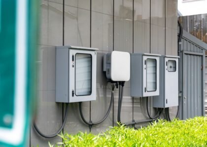 Image of outdoor solar battery enclosures mounted on a wall, relevant to solar battery enclosure selection.