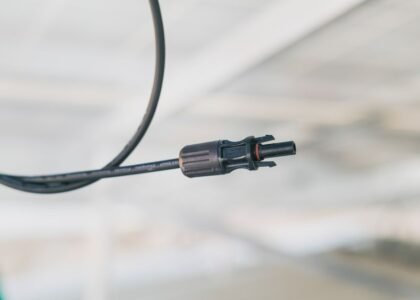 A close-up view of a solar panel cable connector, relevant to choosing the right connectors.
