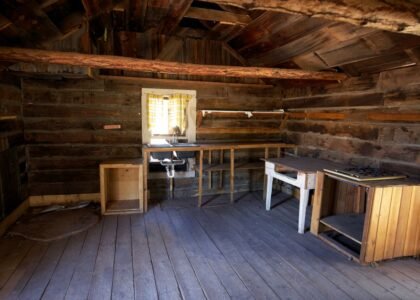 Interior view of a rustic cabin, highlighting the need for solar powered fans.