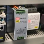 A DC to DC converter and related components in a power system setup.
