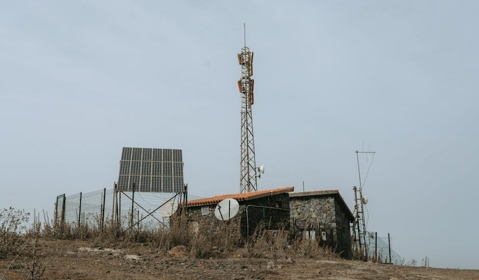 Image showing solar panels and a communication tower, relevant to high and low frequency inverters.