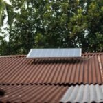 A solar panel mounted on a corrugated metal roof, relevant to buying solar generators.