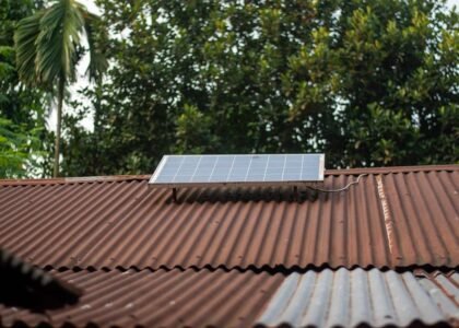 A solar panel mounted on a corrugated metal roof, relevant to buying solar generators.
