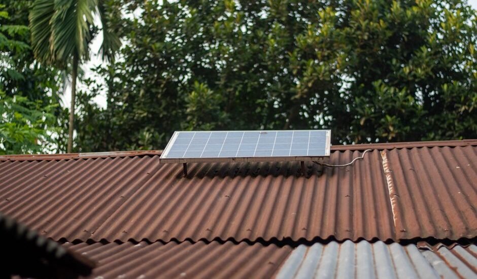 A solar panel mounted on a corrugated metal roof, relevant to buying solar generators.