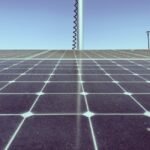 A close-up view of solar panels under a clear sky, illustrating how to test solar panel output.