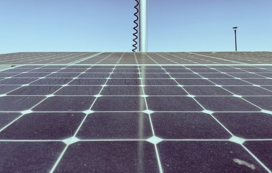 A close-up view of solar panels under a clear sky, illustrating how to test solar panel output.