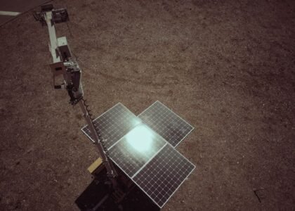 A solar panel array on the ground, relevant to lithium iron phosphate vs AGM batteries discussion.