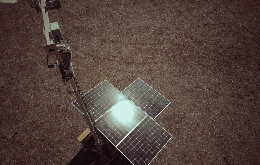 A solar panel array on the ground, relevant to lithium iron phosphate vs AGM batteries discussion.