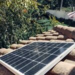A solar panel installed on a tiled roof, relevant for portable inverter kit discussions.