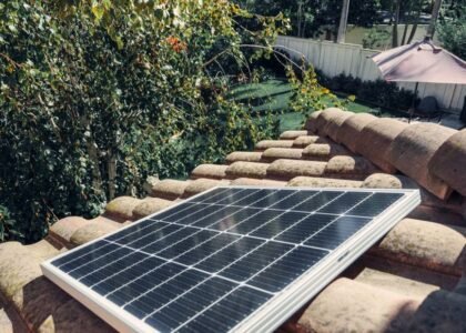 A solar panel installed on a tiled roof, relevant for portable inverter kit discussions.