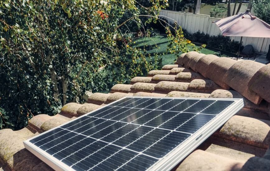 A solar panel installed on a tiled roof, relevant for portable inverter kit discussions.