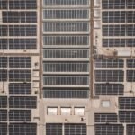 Aerial view of a large solar panel installation, illustrating potential mismatch losses in solar energy systems.