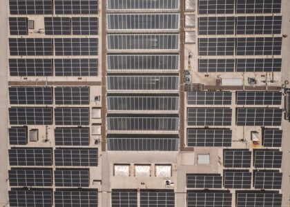 Aerial view of a large solar panel installation, illustrating potential mismatch losses in solar energy systems.