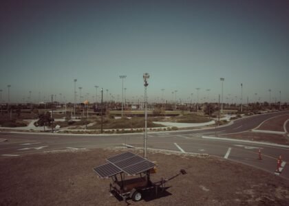 A solar generator kit with panels on a trailer in an open field, relevant to solar generator kits.