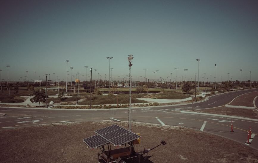 A solar generator kit with panels on a trailer in an open field, relevant to solar generator kits.