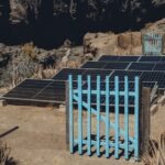 Solar panels arranged in a desert landscape, relevant to gel vs lithium battery discussion.