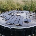 Curved roof with solar panels installed, illustrating solar panel installation techniques.