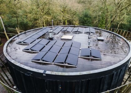 Curved roof with solar panels installed, illustrating solar panel installation techniques.