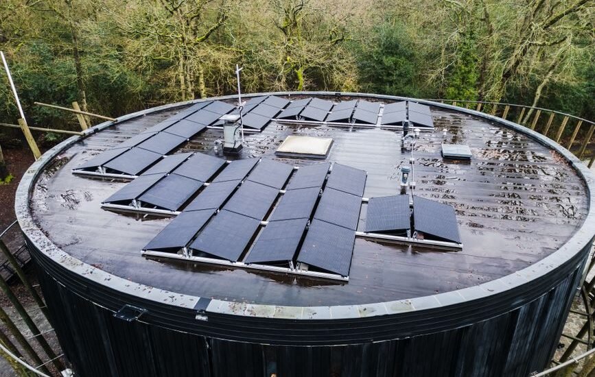Curved roof with solar panels installed, illustrating solar panel installation techniques.