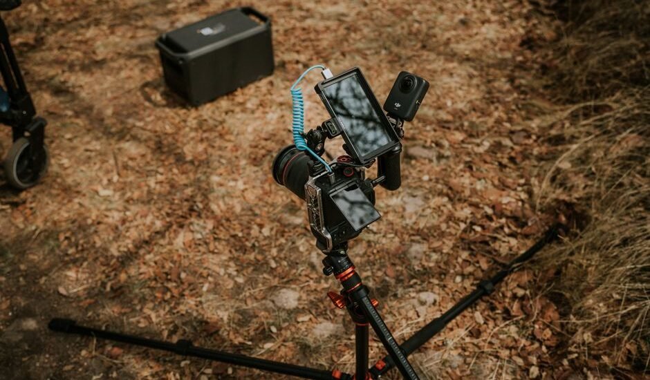 A camera on a tripod with a power source, relevant to lead crystal vs lithium-ion battery discussion.