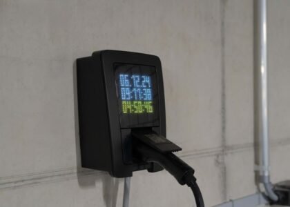 A battery monitor displaying voltage and current, relevant to series vs parallel battery circuits.