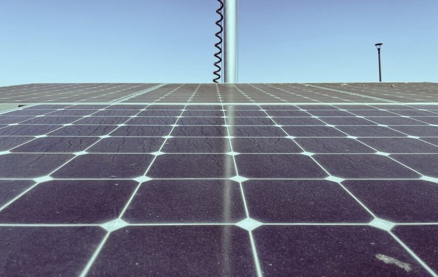 Image showing solar panels with visible wear, relating to efficiency degradation over time.
